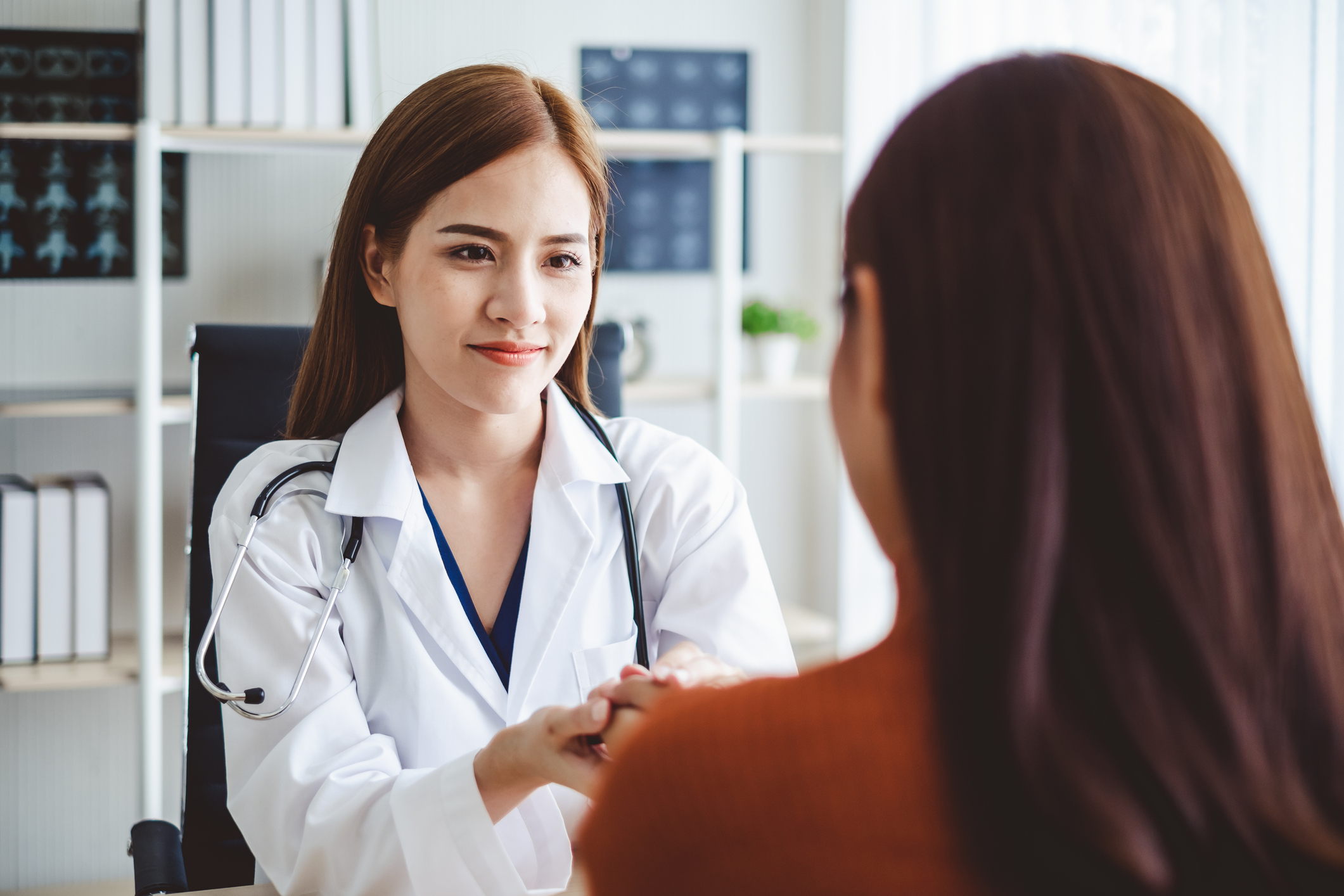 young female doctor general practitioner specialist consulting a female patient obstetrics and gynaecology women's health