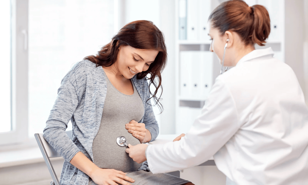 Image of doctor checking pregnant women