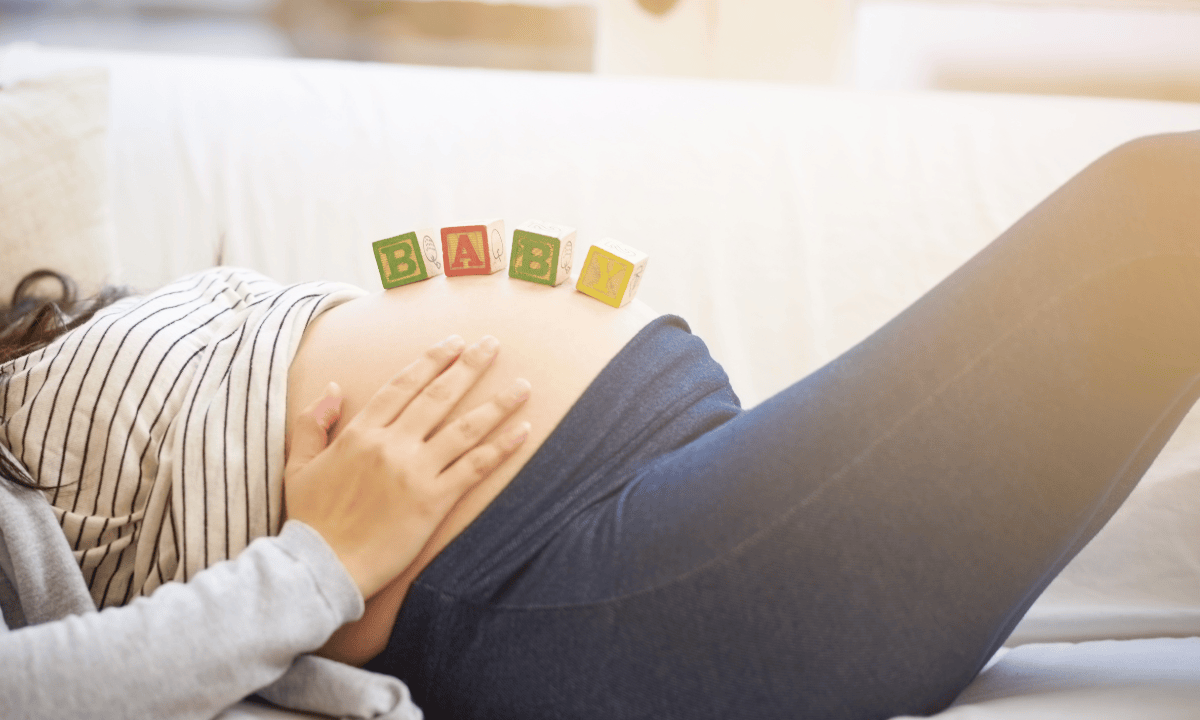 Image of mother in her third trimester laying down