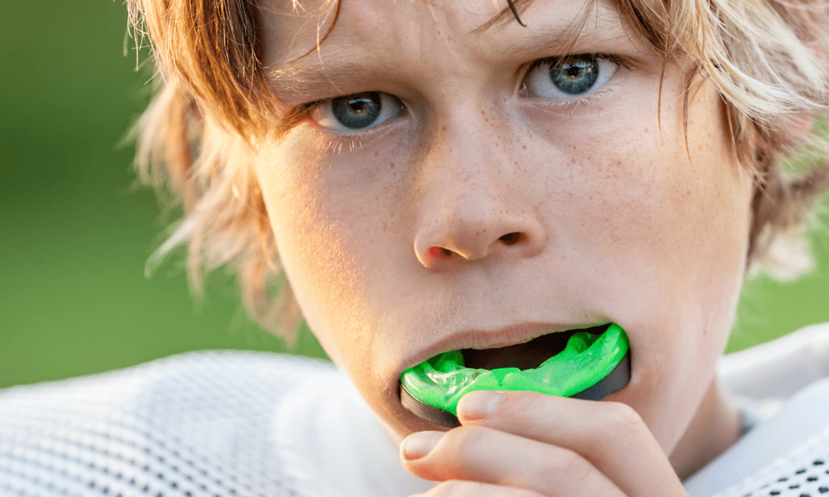 image of boy using a mouth guard