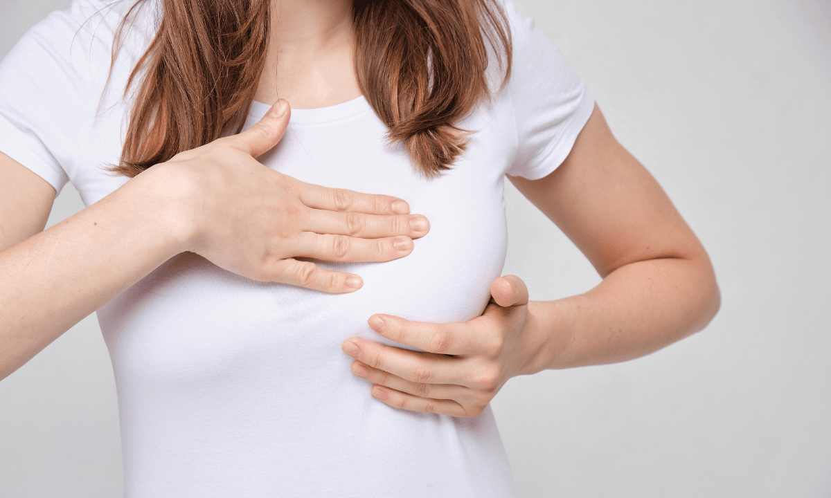 woman massaging her breast