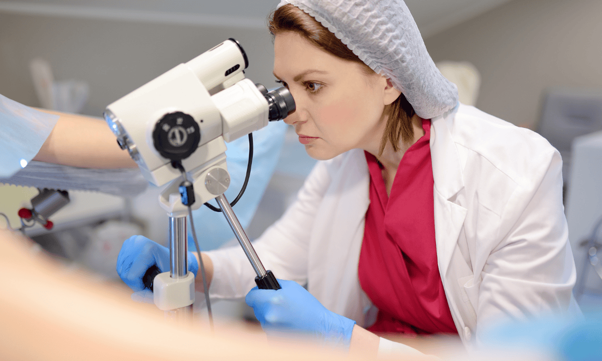 Doctor performing colposcopy