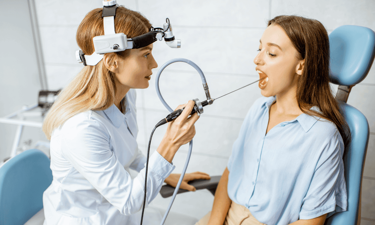 A photo of a doctor performing an endoscopic procedure on a patient