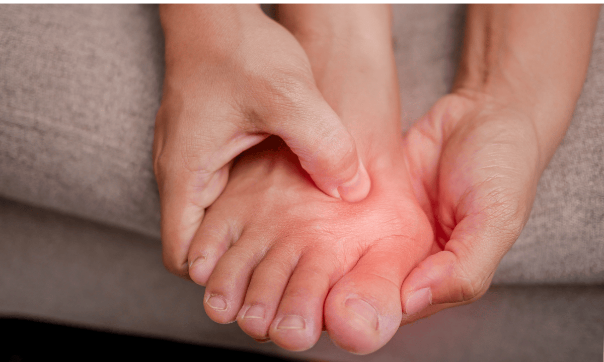 Man holding his foot due to bunion