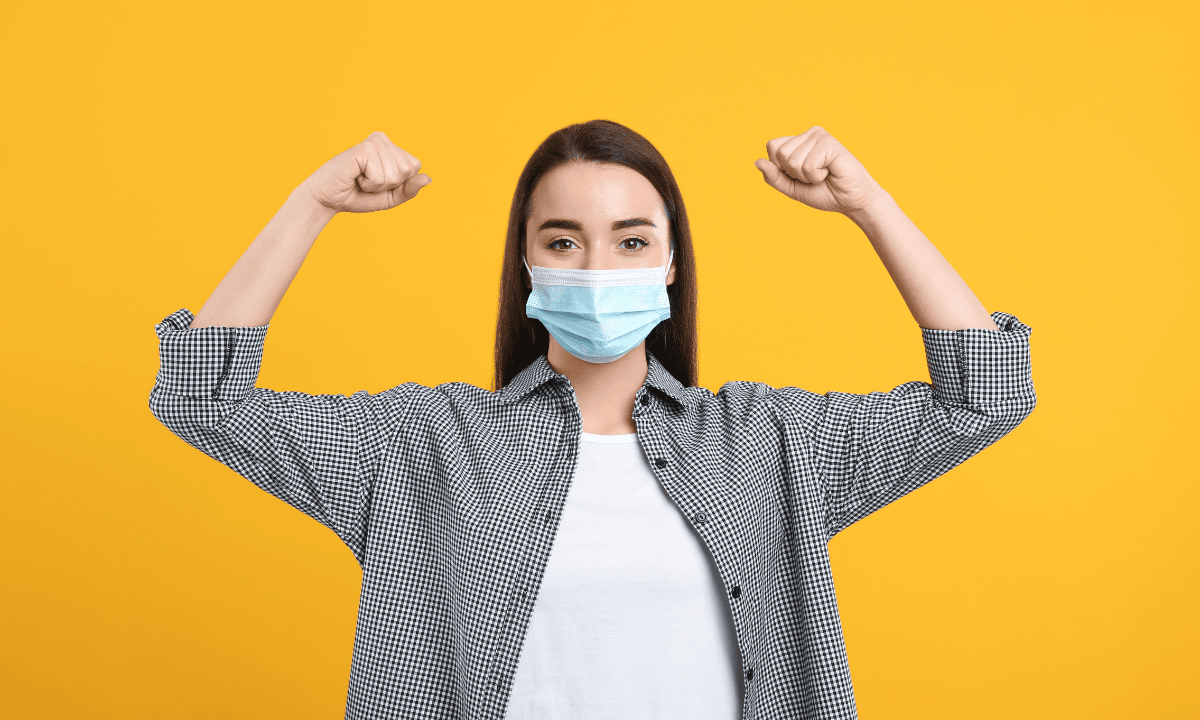 women wearing mask showing fighting spirit against Covid-19