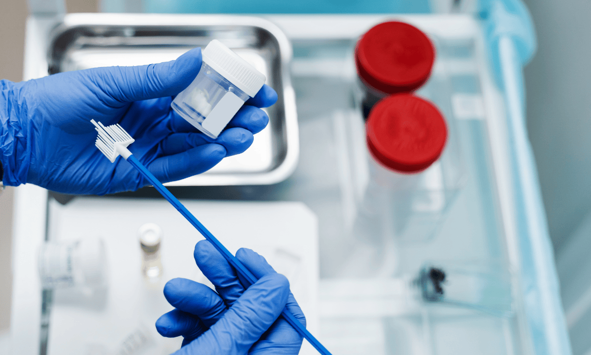 Pap smear sample collection kit with swab and container