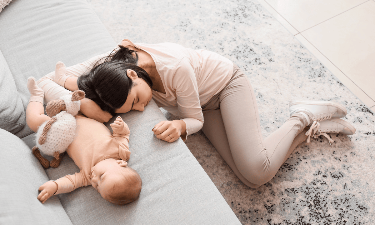 image of mother sleeping with her baby