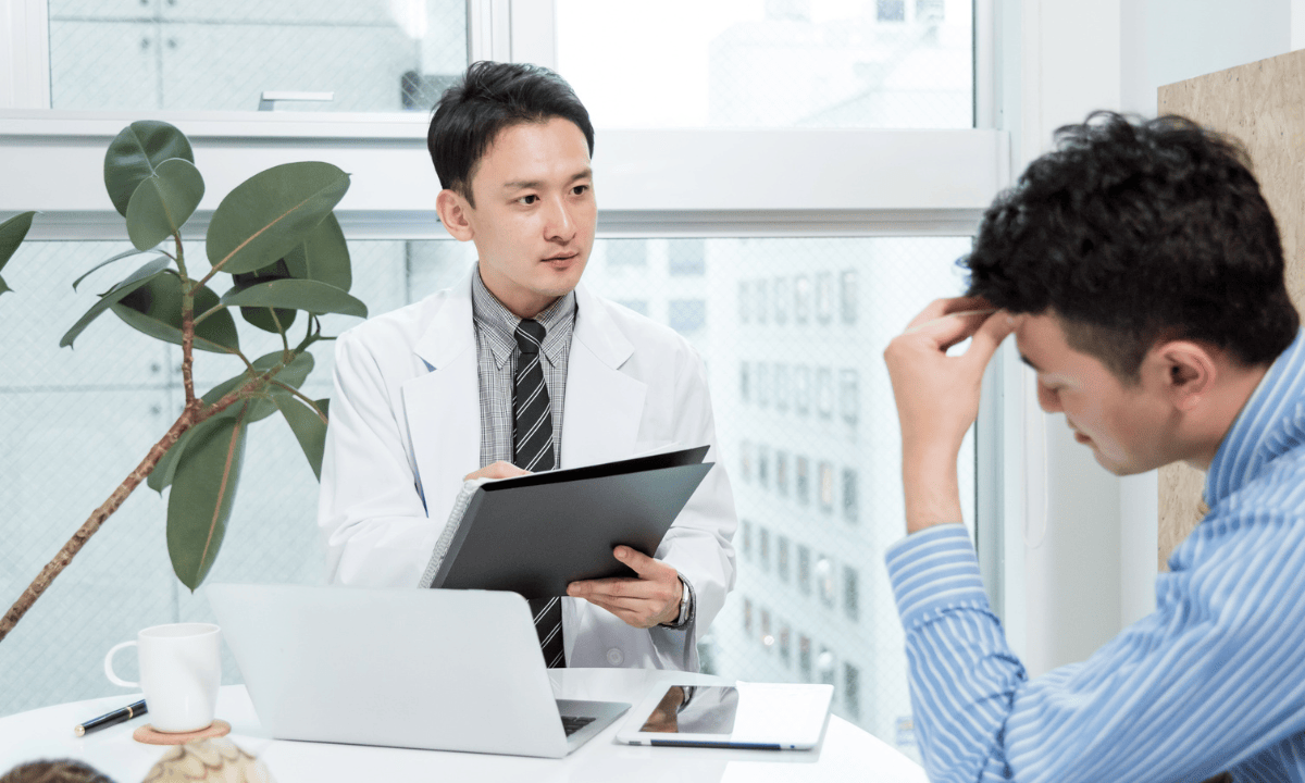 image of a doctor consulting patient