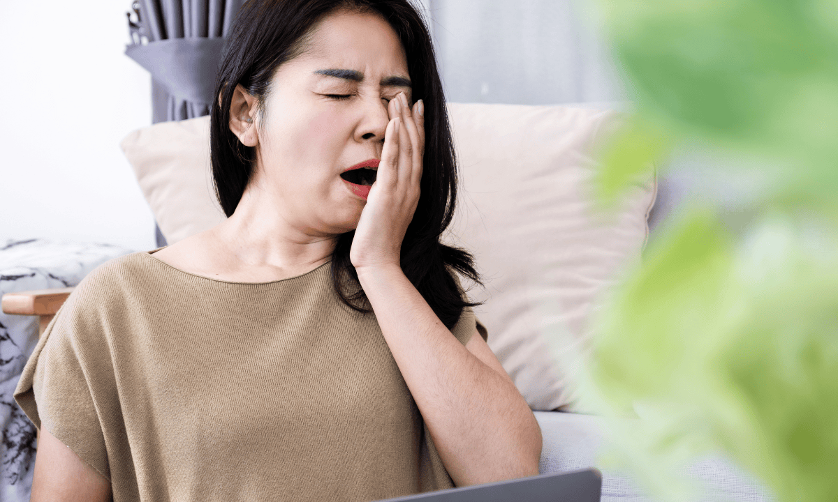women yawning due to fatigue