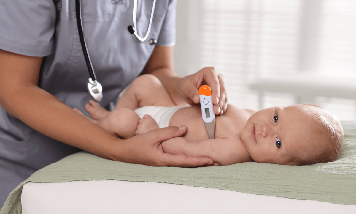 image of a baby taking thermometer
