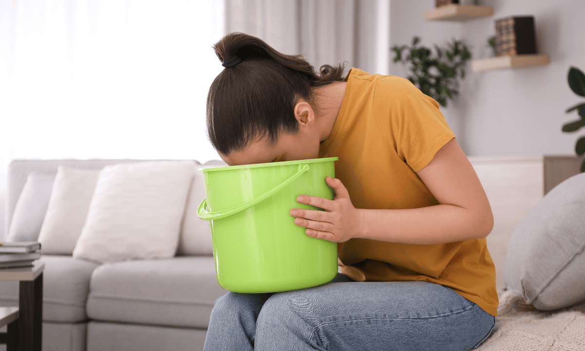 image of woman vomiting