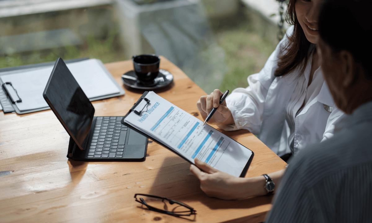 Image showing insurance provider explaining insurance to patient