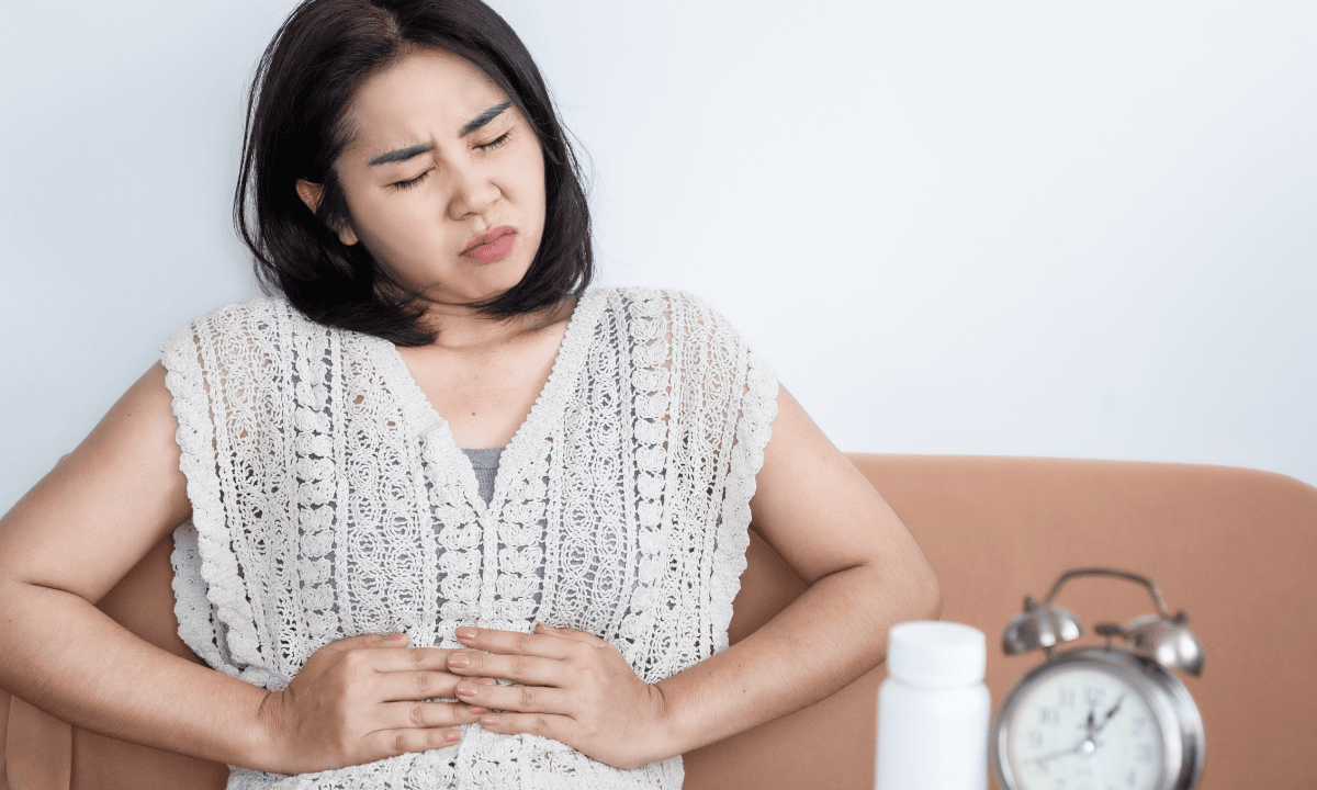 image of woman with tummy pain