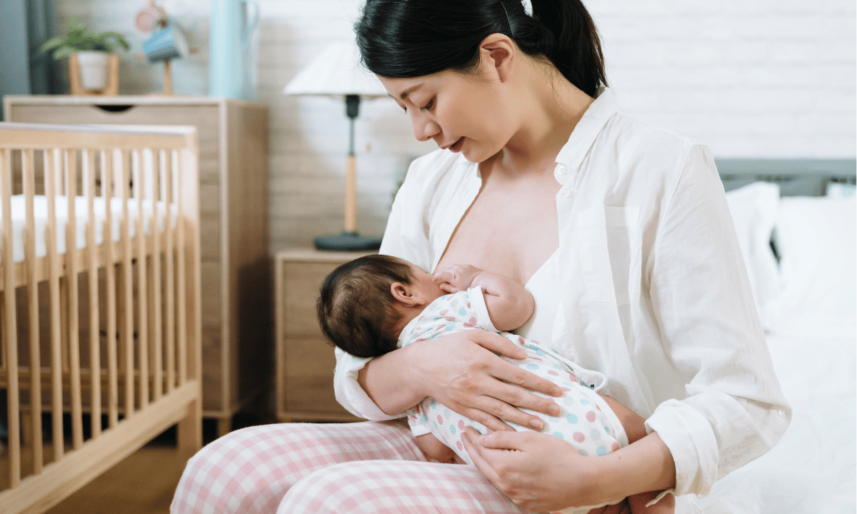 woman breastfeeding a baby