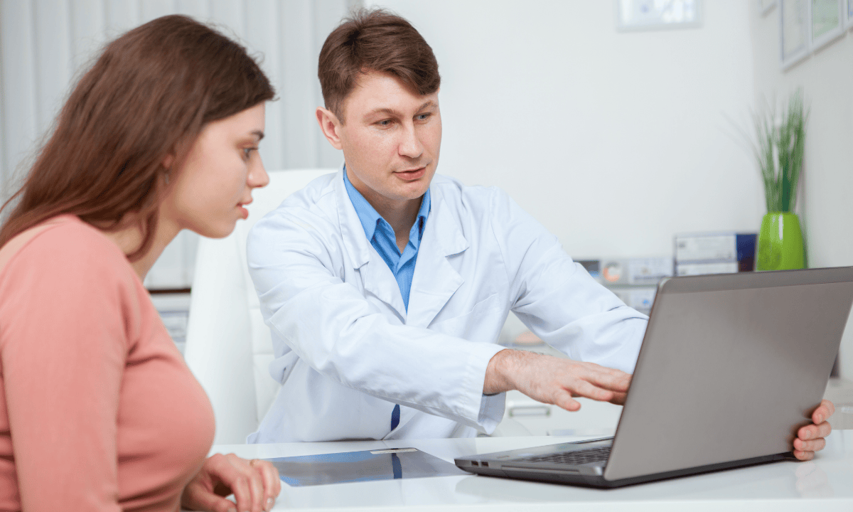image of a doctor consulting a woman