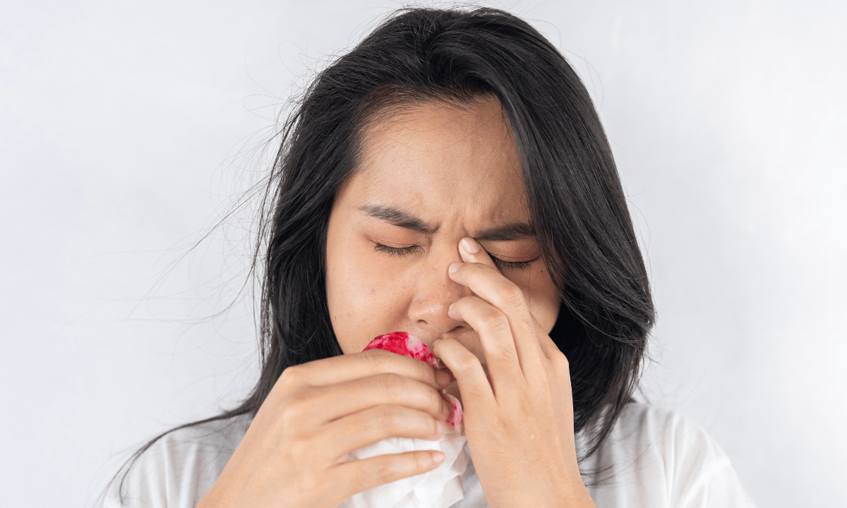 image of women with nose bleeding