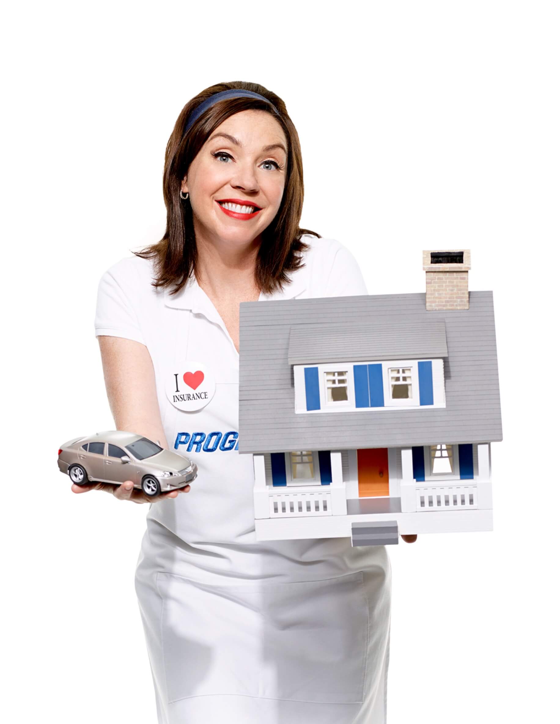 Flo holding miniature home and car