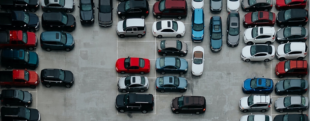 A top down view of cars in a parking lot