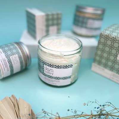 Image of an open jar of body butter