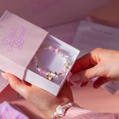 Finished lampwork jewellery in picnic blanket's packaging