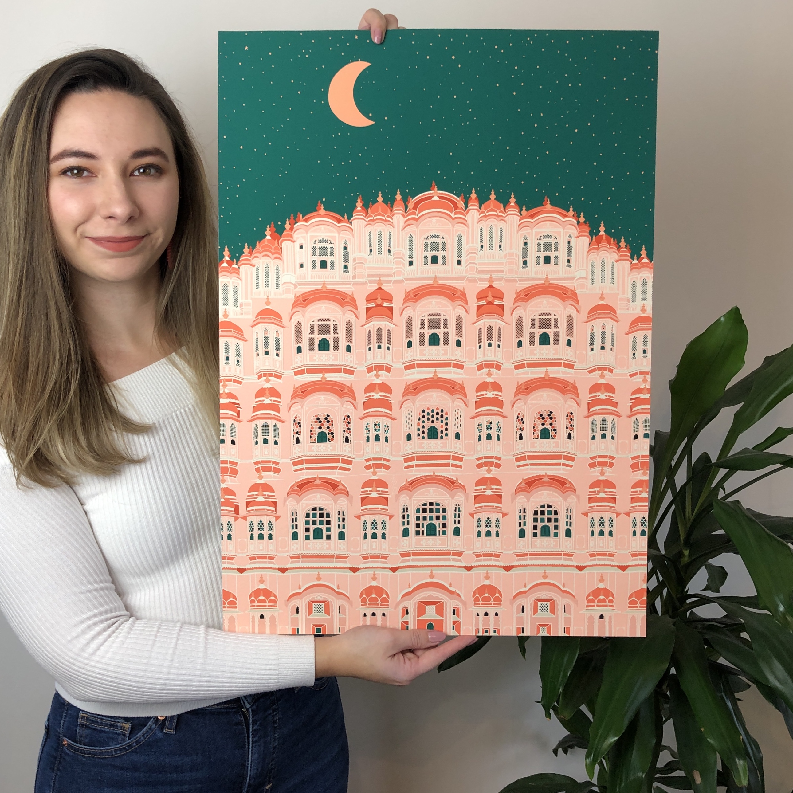 Jess holding up the Hawa Mahal night Print