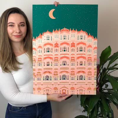 Jess holding up the Hawa Mahal night Print
