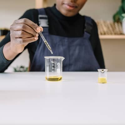 Ibi mixing oils at her desk