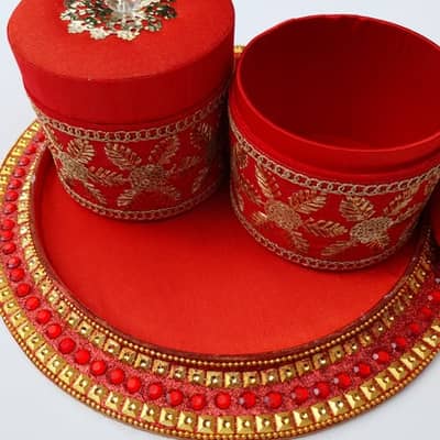 red jewelled tray with 2 matching boxes