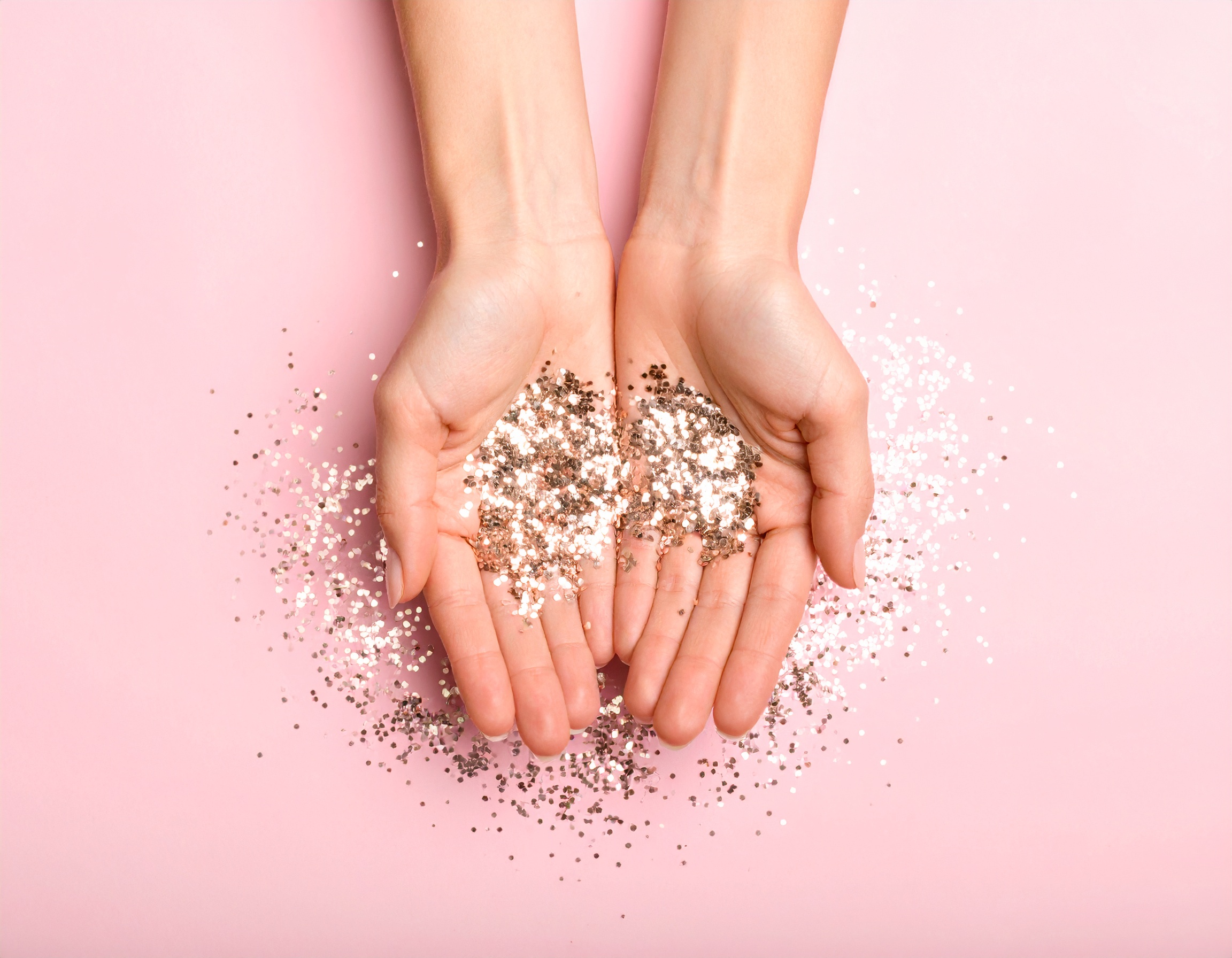 Hands holding glitter