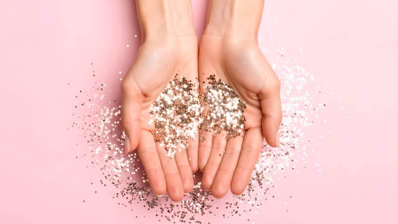 Hands holding glitter