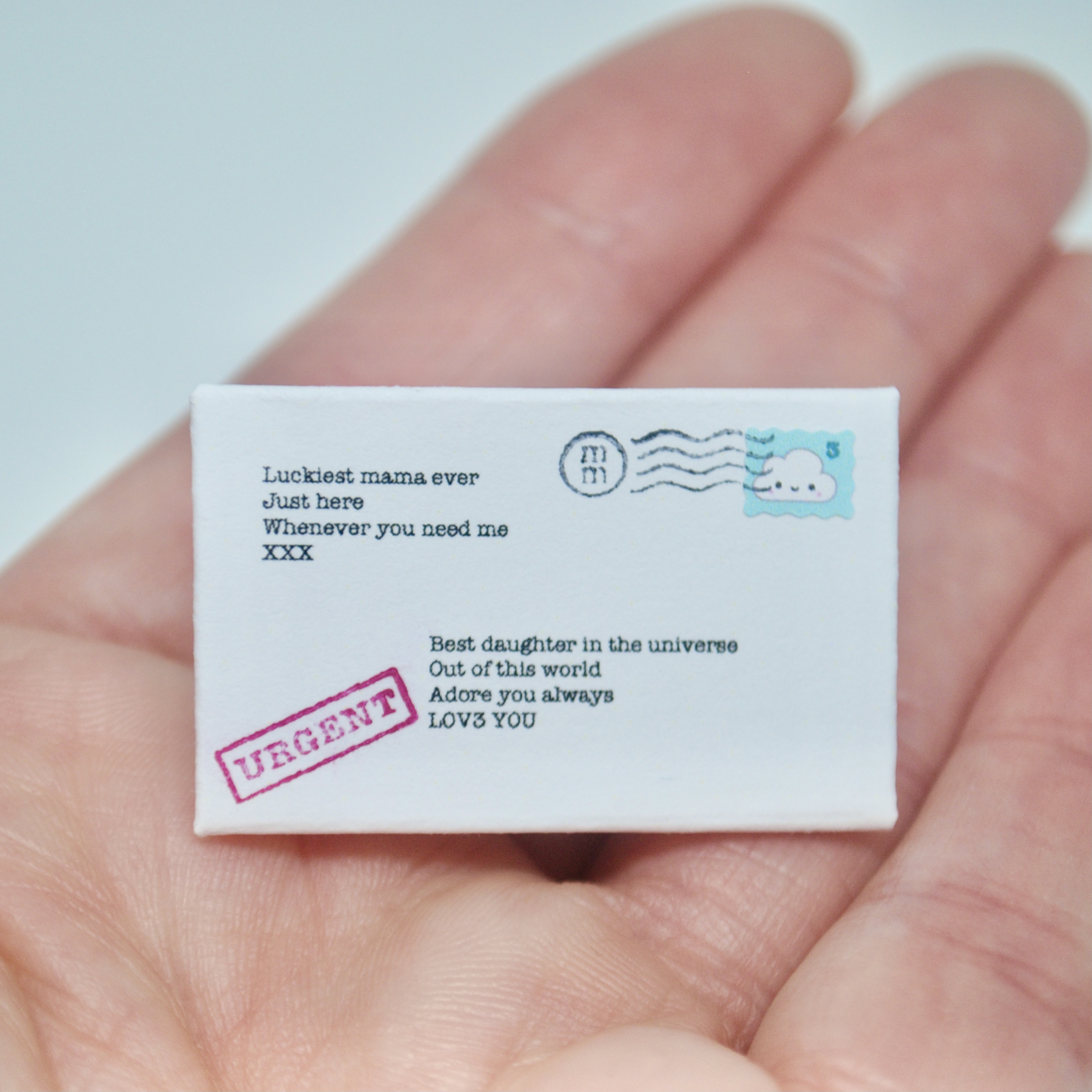 Tiny letter in a hand