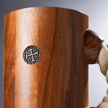 chuug rope handle beer tankard being made being buffed to smooth wood teak finish handcrafted with viking coin inset
