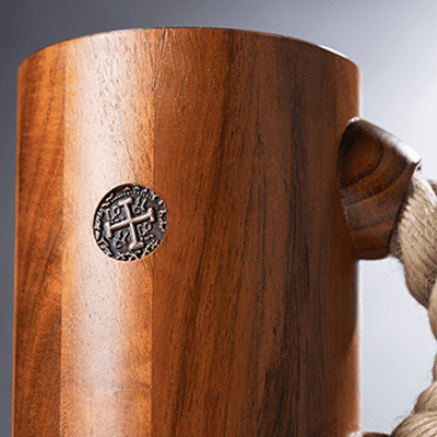 chuug rope handle beer tankard being made being buffed to smooth wood teak finish handcrafted with viking coin inset