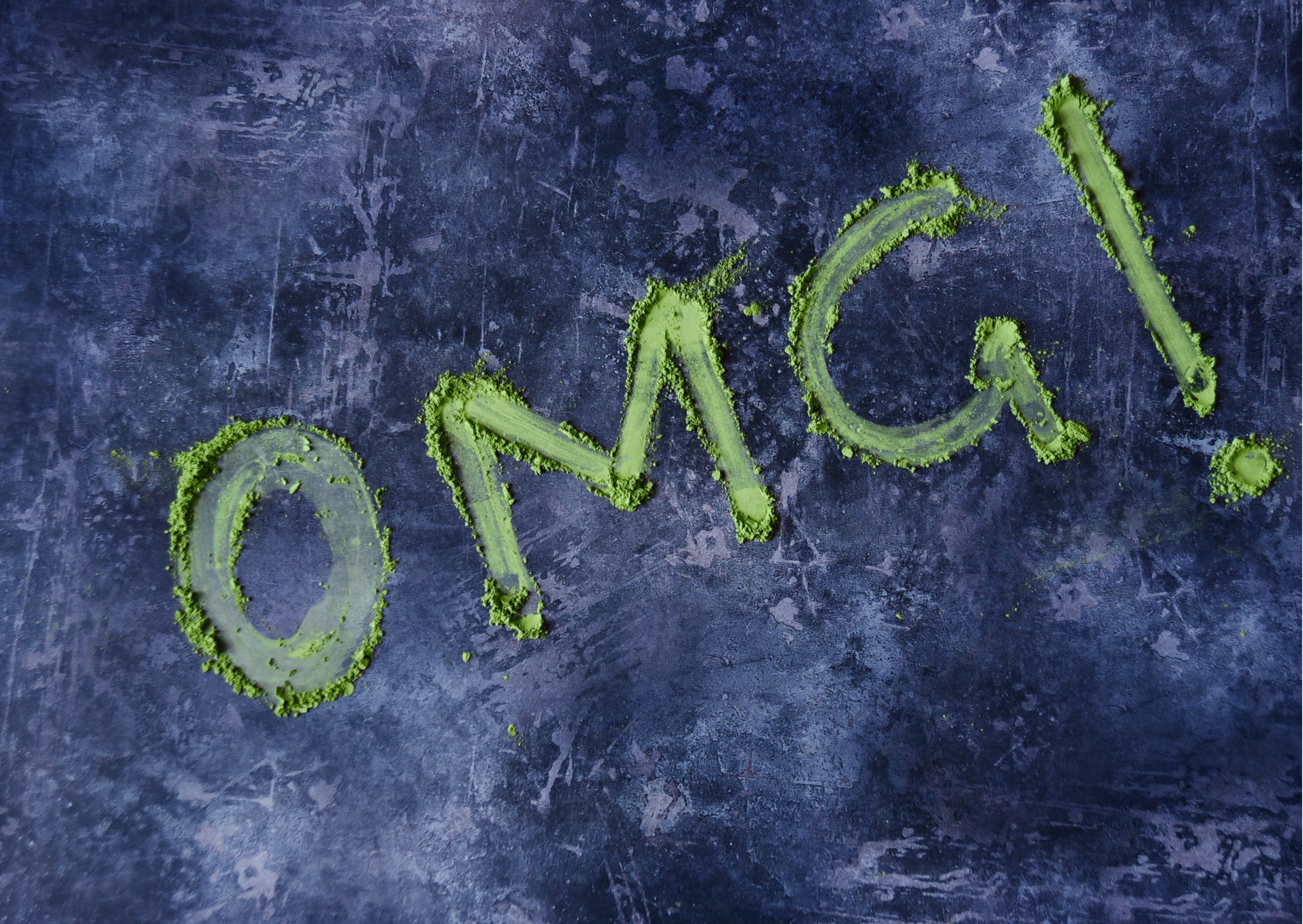 hands holding a bowl of matcha latte