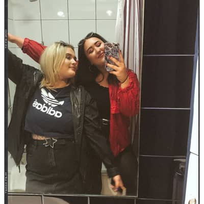 Two girls stood in mirror