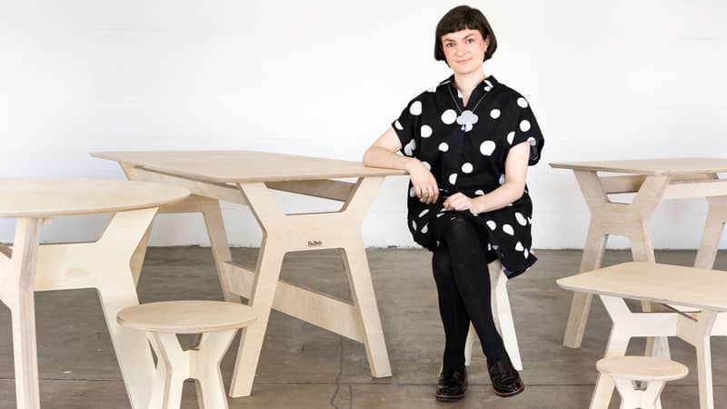 Alice Jacobs sitting at Ply-Works Plywood Desk