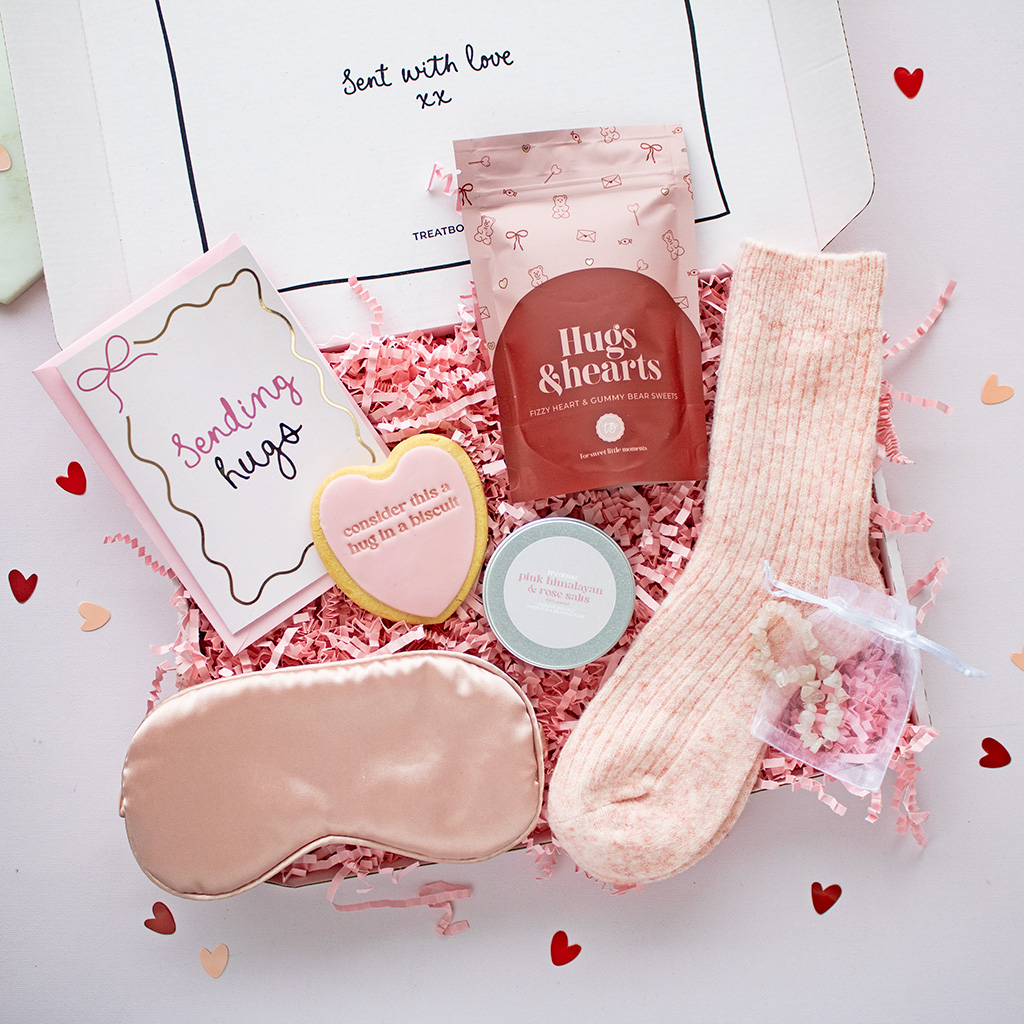 treatbox mindful collection flat lay including crystal moons and stars, quartz braclets, moon and star socks, notepads, butteryfly pins