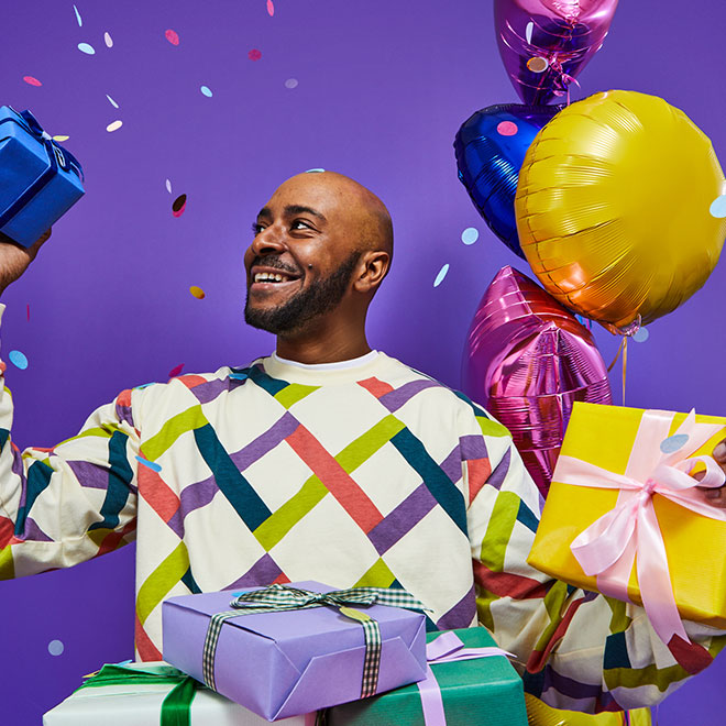 a man surrounded by presents