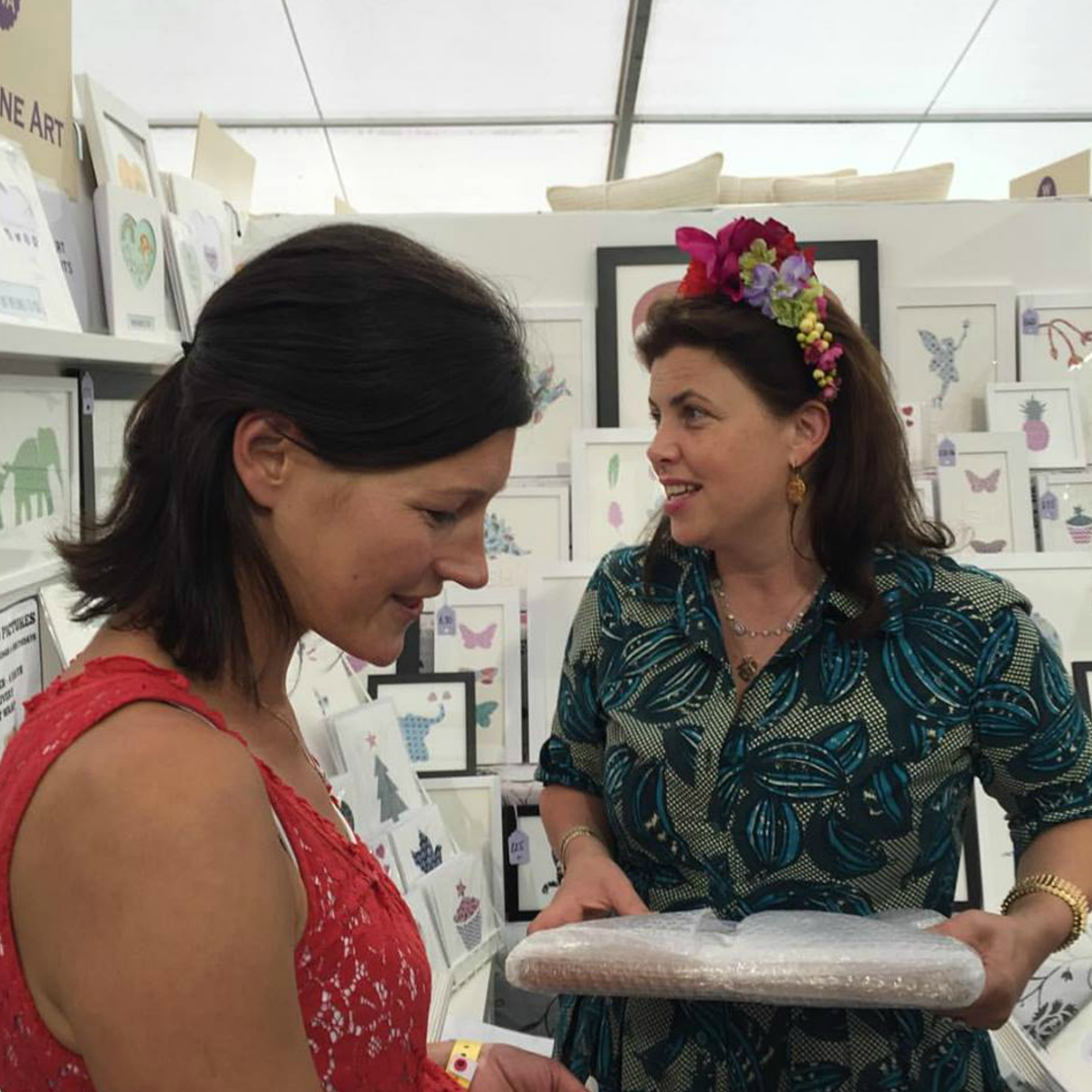 Kirstie Allsopp purchasing a framed picture at The Handmade Fair, Hampton Court