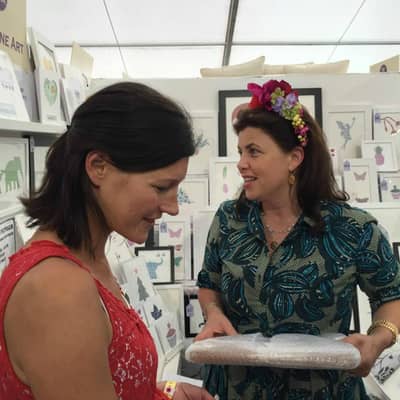 Kirstie Allsopp purchasing a framed picture at The Handmade Fair, Hampton Court