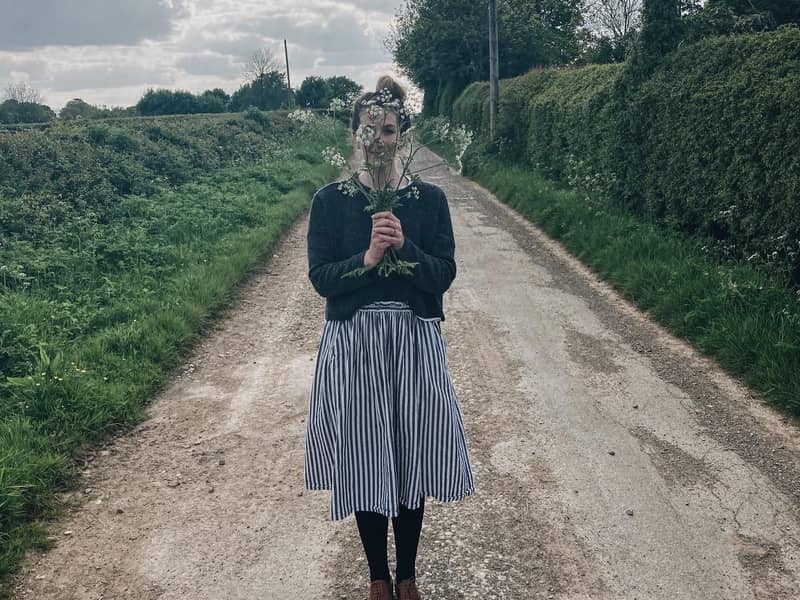 The jewellery designer Emily in a country lane