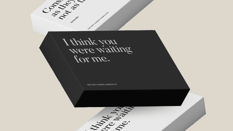 black and white gift boxes with quotes on front of boxes
