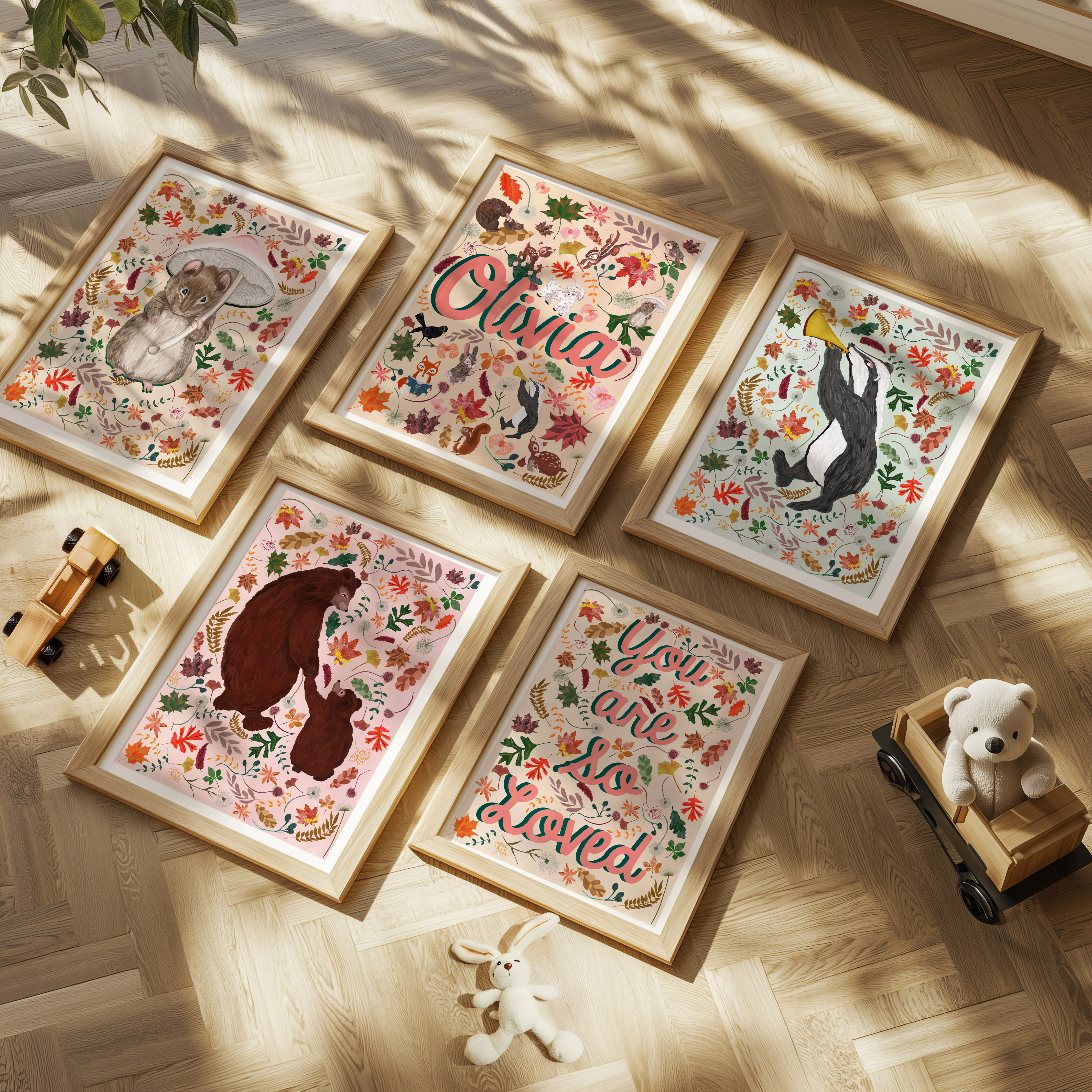 A kids room gallery wall displaying hand painted illustrated personalised name prints and birth prints