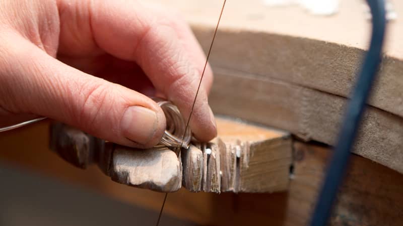 Cutting silver rings with a jewellers saw