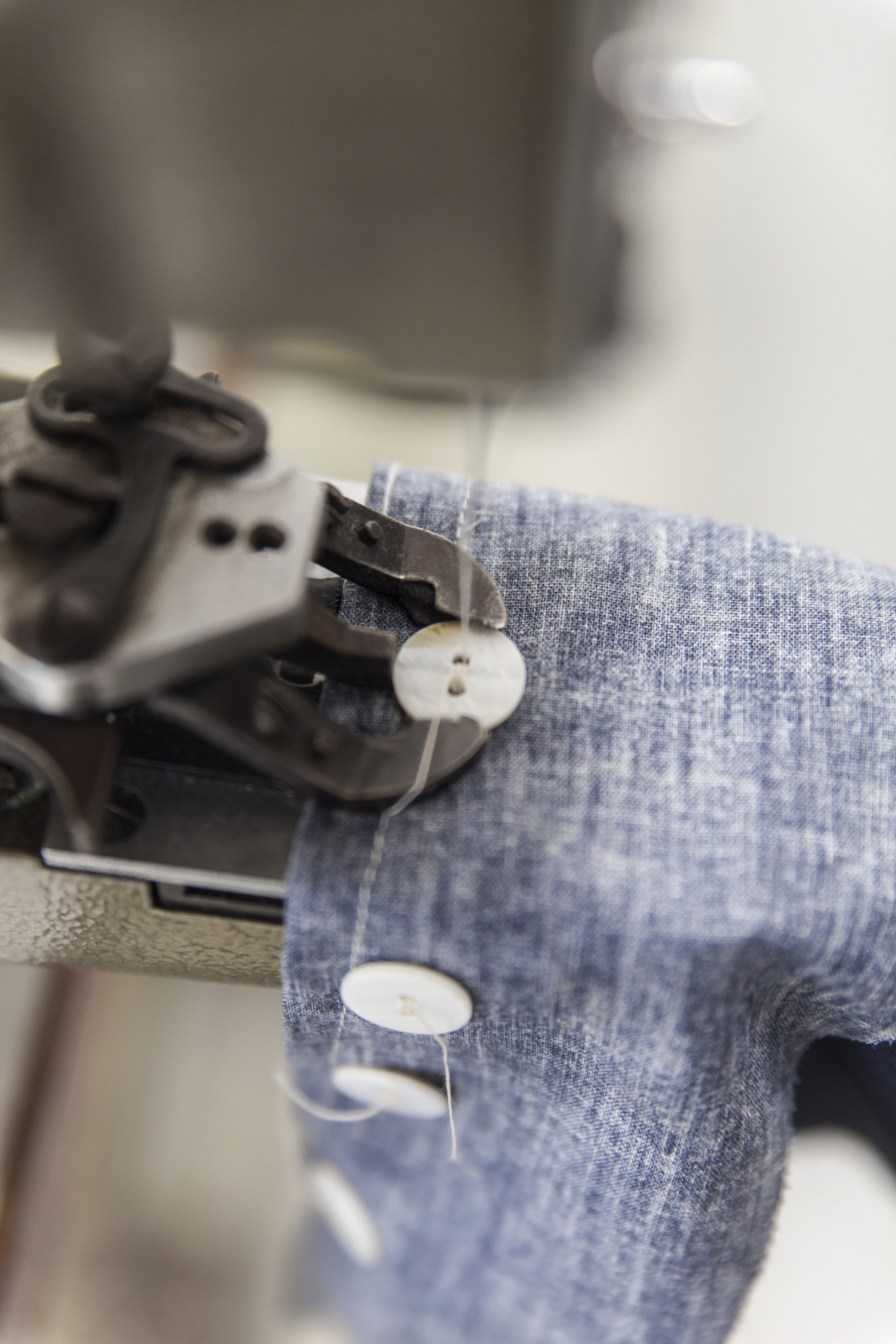 Hand stitching the buttons