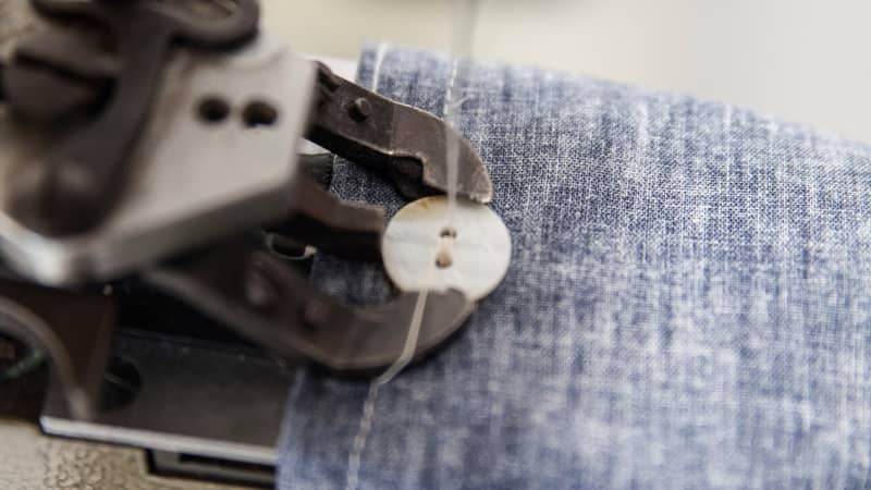 Hand stitching the buttons