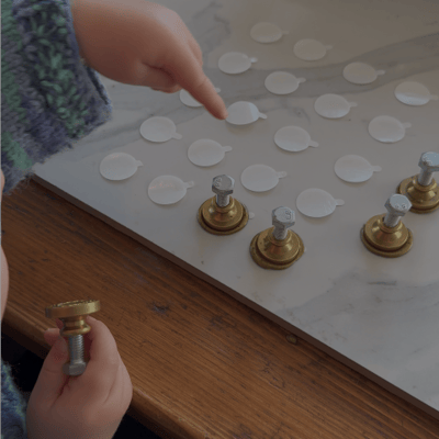 a 2 year old making wax seals
