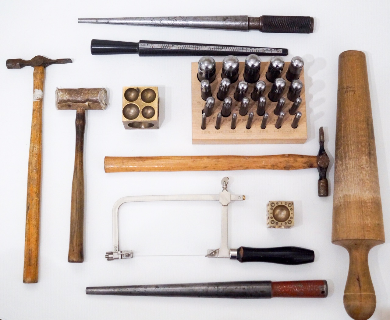 traditional jewellery making tools played out on white background
