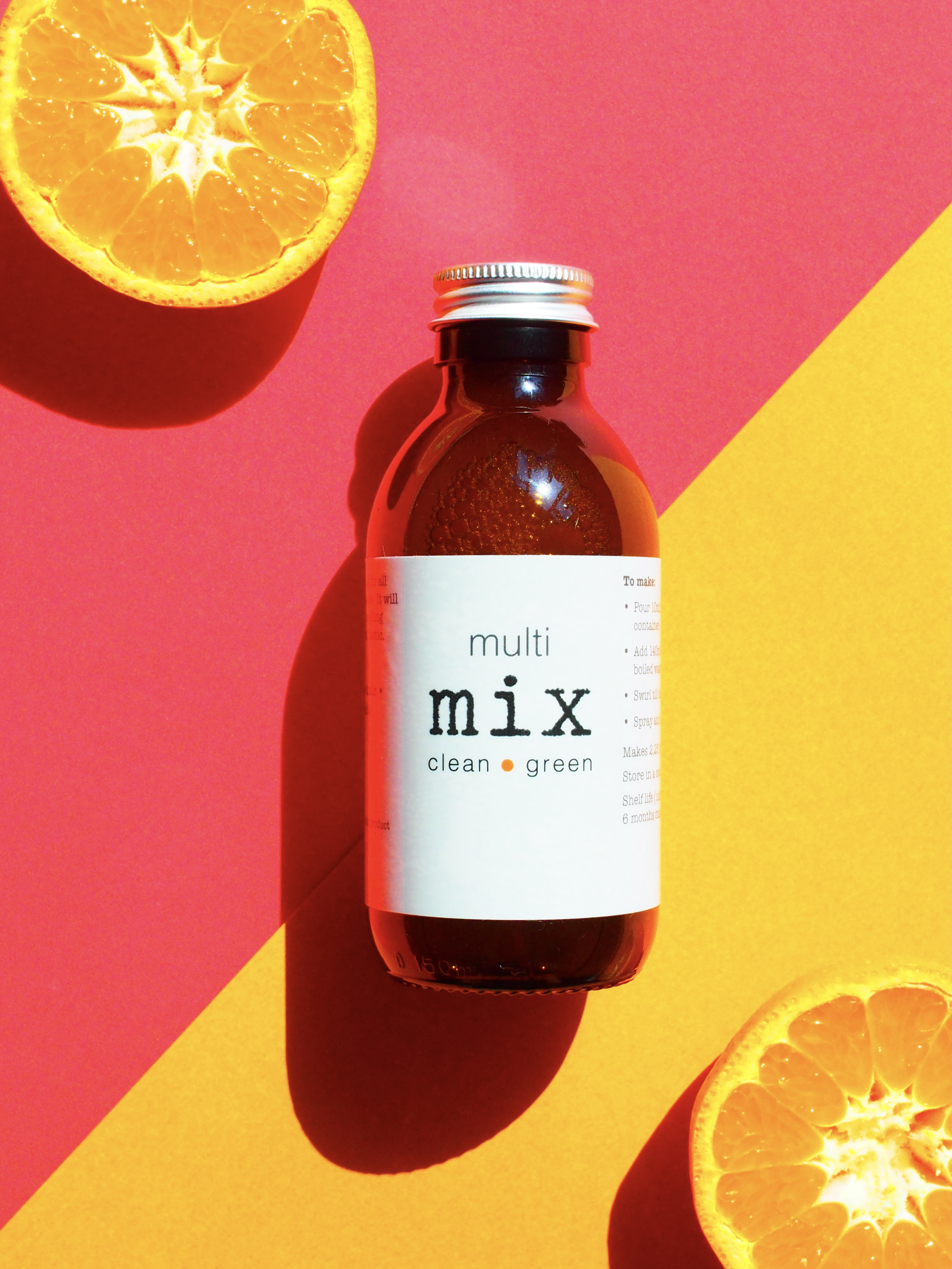 Multi purpose eco cleaning zero waste plastic free on pink and yellow background with orange at edges to show organic sweet orange oil used