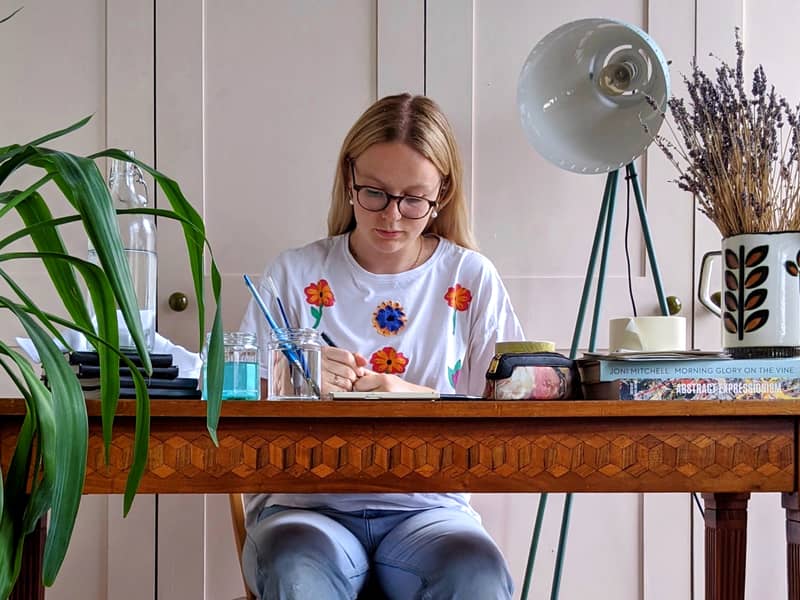 draw the line illustrator, Gaby, at work